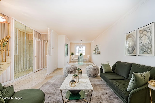 living room featuring crown molding, a chandelier, light tile patterned floors, baseboards, and stairway