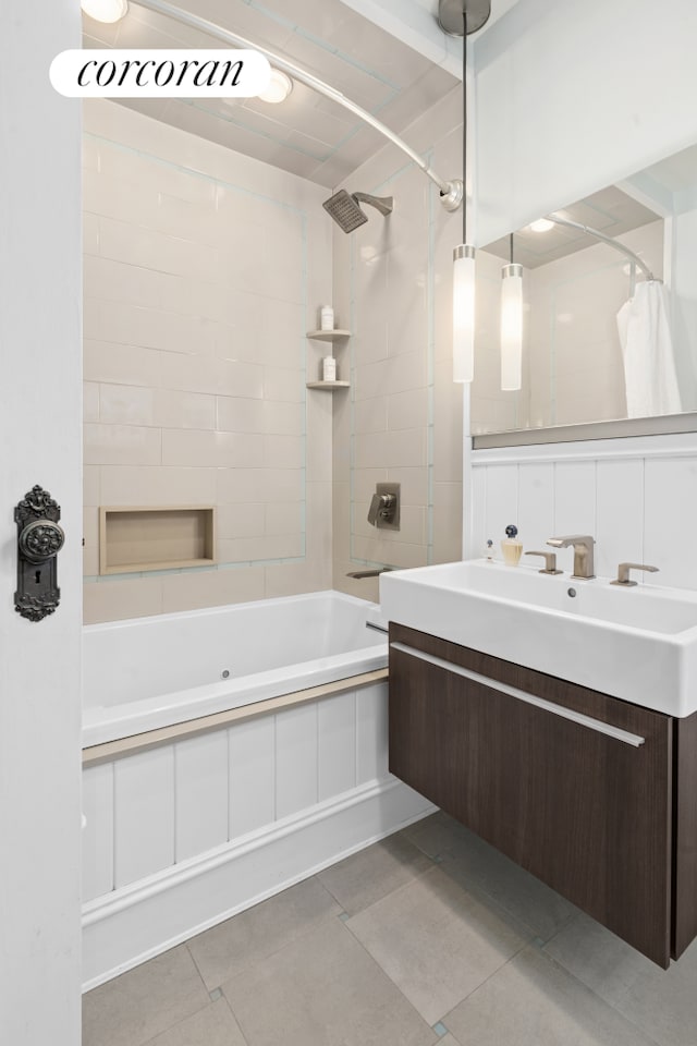 bathroom with tile patterned floors, shower / bath combination with curtain, and vanity