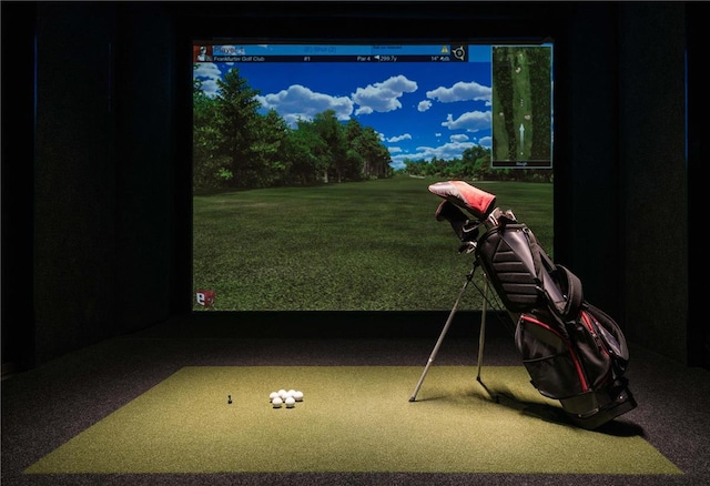 playroom with carpet floors and golf simulator