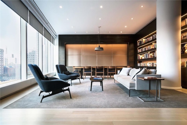 sitting room featuring built in features and recessed lighting