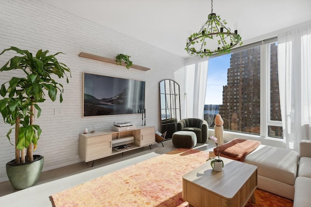 living area with brick wall and finished concrete floors