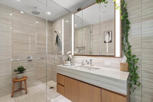 full bathroom with vanity and a shower stall