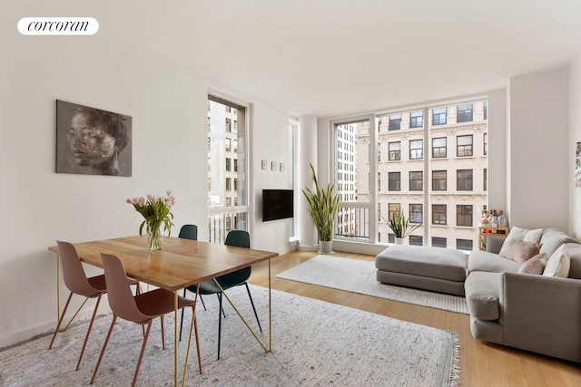 241 5th Ave Unit 10B, New York City, NY 10016 - dining space featuring wood finished floors