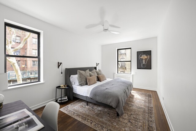 210 W 103rd St Unit 2G, New York City, NY 10025 - bedroom with wood finished floors, baseboards, and ceiling fan