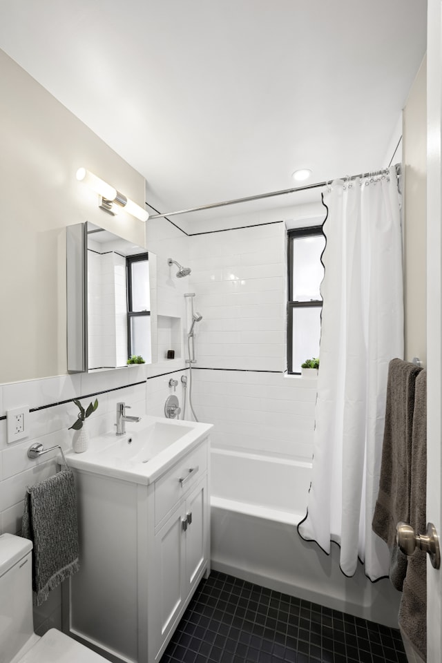 210 W 103rd St Unit 2G, New York City, NY 10025 - bathroom with vanity, healthy amount of natural light, shower / bath combination with curtain, toilet, and tile walls