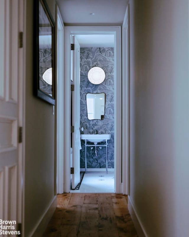 hallway featuring baseboards