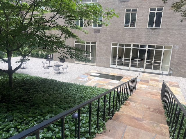 view of patio featuring stairway