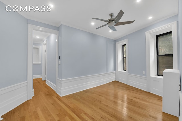 100 Hamilton Pl Unit 2F, New York City, NY 10031 - empty room featuring light wood finished floors, crown molding, ceiling fan, a wainscoted wall, and recessed lighting