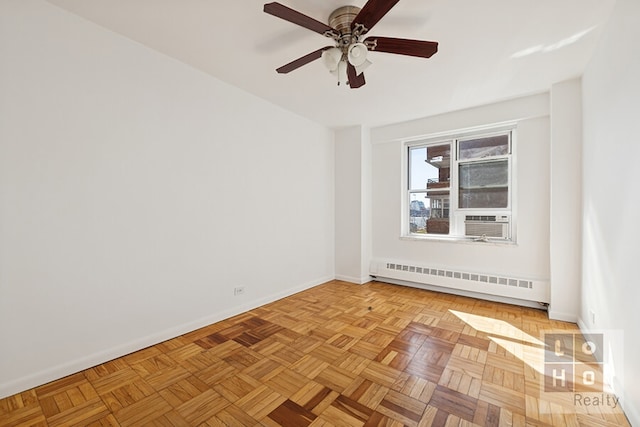 spare room featuring baseboards, ceiling fan, a baseboard heating unit, and cooling unit