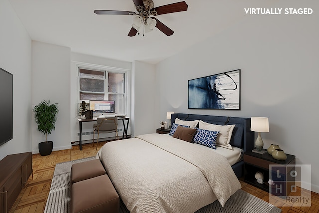 bedroom featuring ceiling fan and baseboards