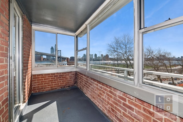 unfurnished sunroom with a view of city