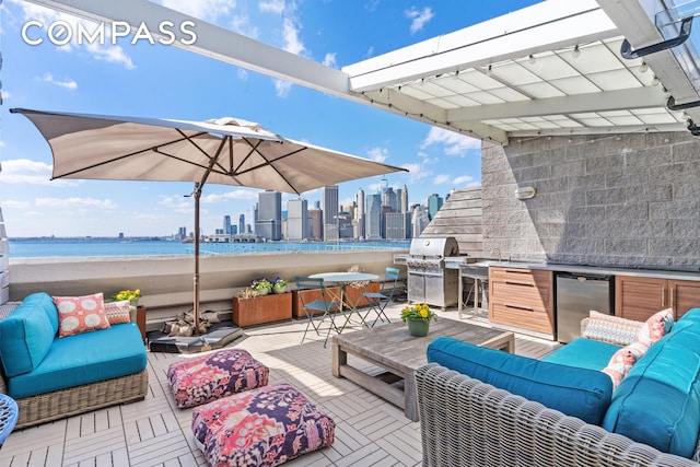 360 Furman St Unit 734, New York City, NY 11201 - view of patio with outdoor lounge area, a grill, a skyline view, and a water view
