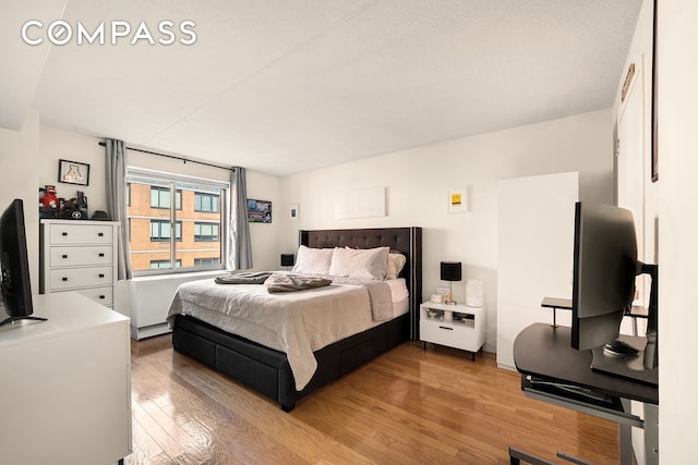 bedroom with light wood-type flooring
