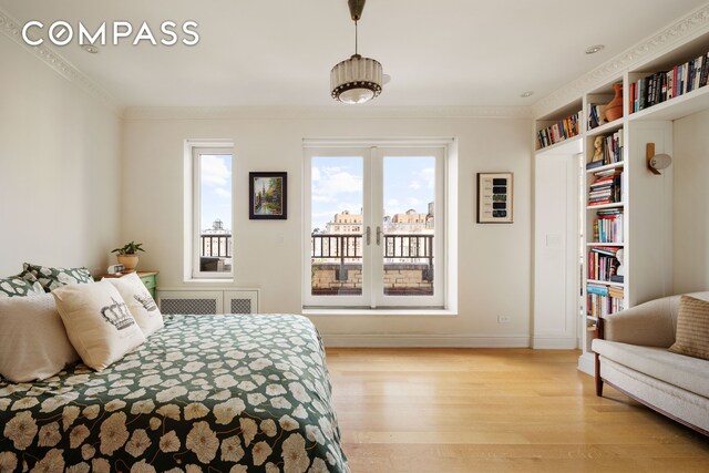309 W 86th St Ph, Ph, New York City, NY 10024 - bedroom featuring access to exterior, light wood-style flooring, baseboards, and crown molding