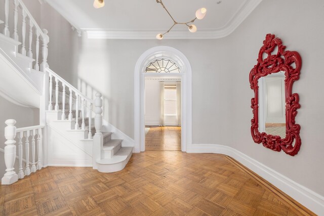 1342 Lexington Ave, New York City, NY 10128 - foyer featuring ornamental molding, baseboards, stairs, and a chandelier