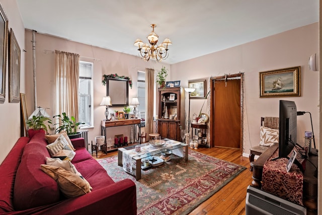 30-53 23rd St, New York City, NY 11102 - living area with a chandelier and wood finished floors