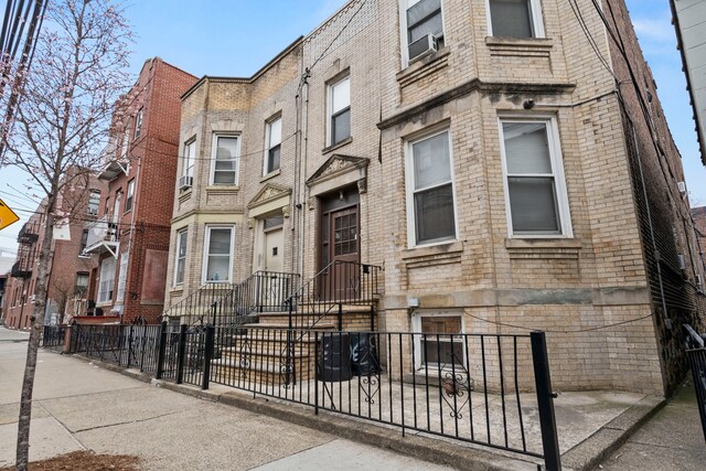 30-53 23rd St, New York City, NY 11102 - view of property with a fenced front yard