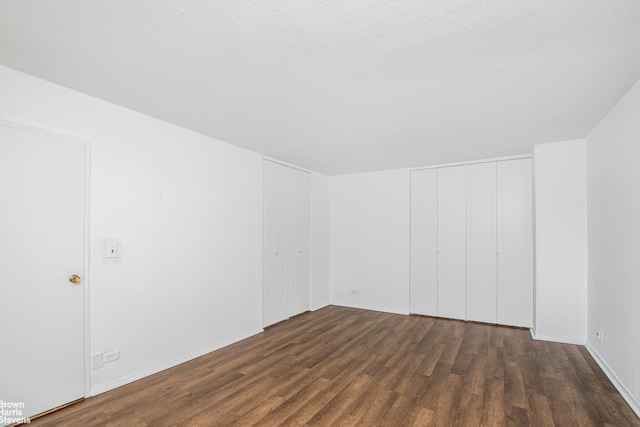 spare room featuring wood finished floors