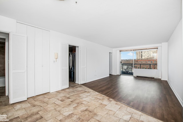 interior space with baseboards and stone finish flooring
