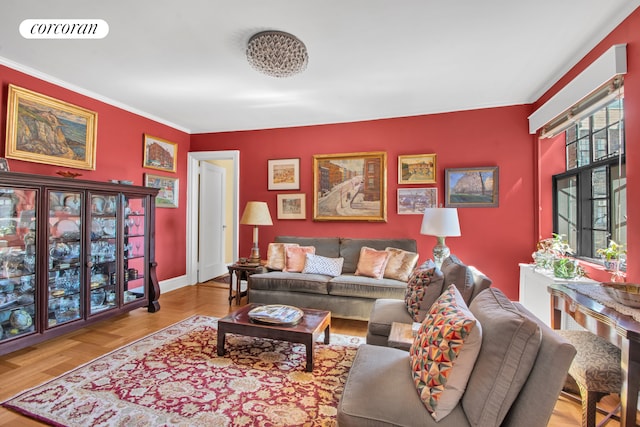 living area with baseboards, visible vents, and ornamental molding