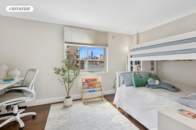 575 Main St Unit 903, New York City, NY 10044 - bedroom featuring a desk, wood finished floors, baseboards, and ornamental molding