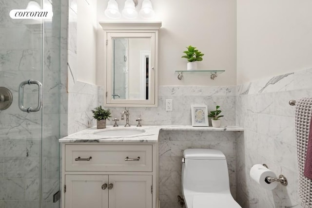 575 Main St Unit 903, New York City, NY 10044 - full bath featuring tile walls, a stall shower, vanity, toilet, and wainscoting