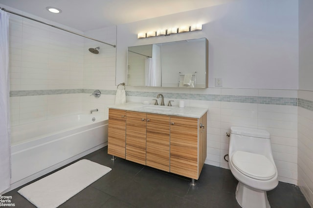 full bath with tile walls, tile patterned flooring, shower / tub combo, vanity, and toilet