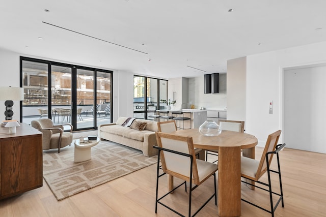 1025 Pacific St Unit 2A, New York City, NY 11238 - dining area with light wood-style flooring and expansive windows