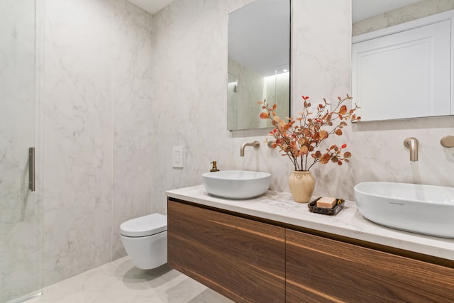 1025 Pacific St Unit 2A, New York City, NY 11238 - full bath with toilet, double vanity, and tile walls