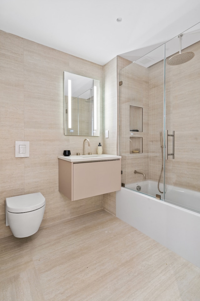 1025 Pacific St Unit 2A, New York City, NY 11238 - bathroom with enclosed tub / shower combo, tile walls, toilet, and vanity