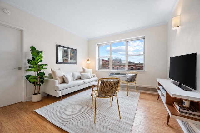 1787 Madison Ave Unit 402, New York City, NY 10035 - living room with ornamental molding, light wood-style floors, and baseboards