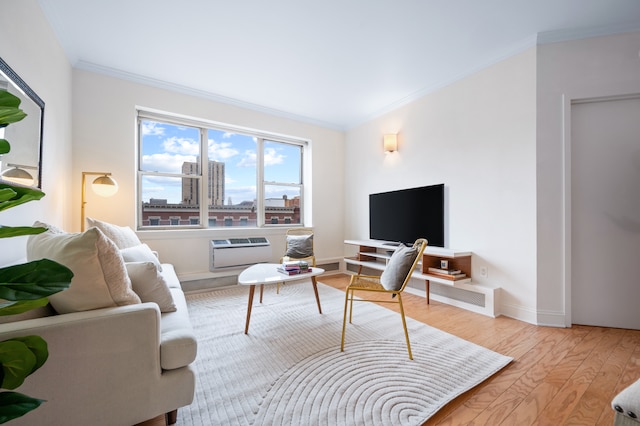 living room featuring wood finished floors, baseboards, and ornamental molding