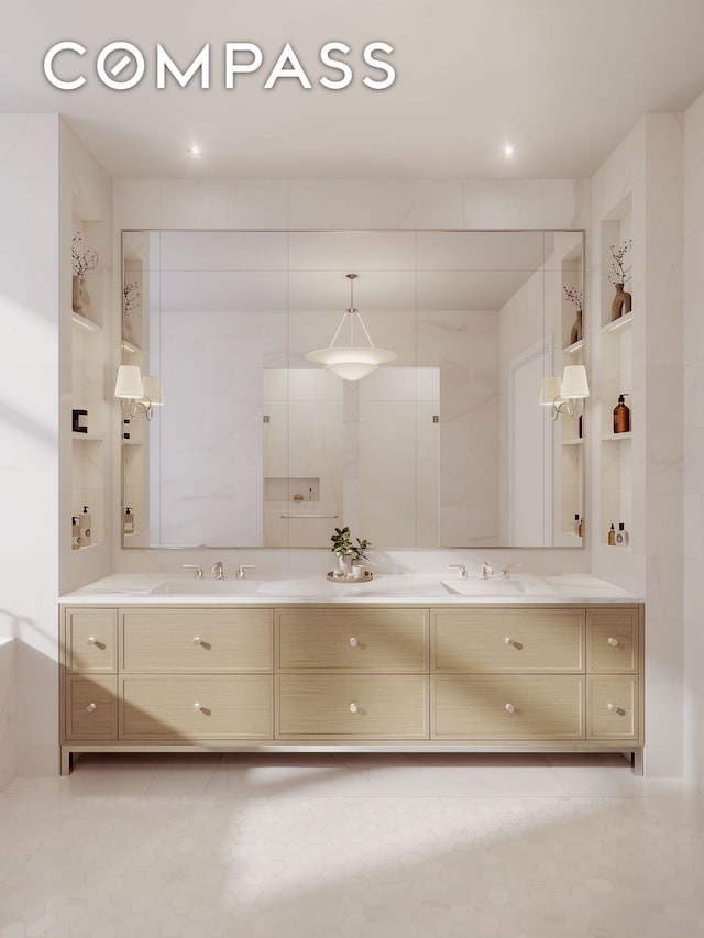 bathroom featuring a sink, double vanity, and tile patterned flooring