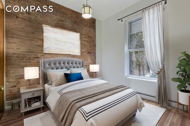 217 W 15th St, New York City, NY 10011 - bedroom with brick wall and wood finished floors