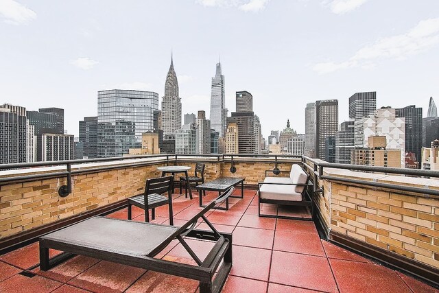 310 E 46th St Unit 18J, New York City, NY 10017 - view of patio with a skyline view
