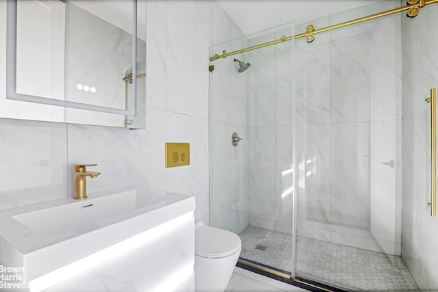 bathroom featuring a marble finish shower, toilet, and vanity