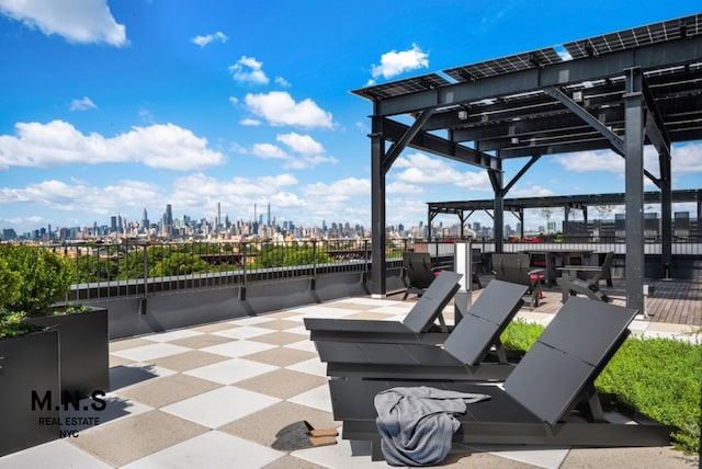 22-54 46th St Unit 704, New York City, NY 11105 - view of patio with a view of skyline