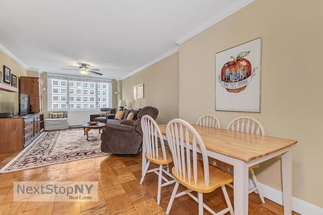 245 E 54th St Unit 22A, New York City, NY 10022 - dining room featuring crown molding, ceiling fan, and baseboards