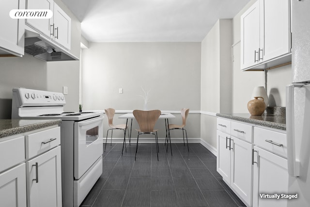 kitchen featuring white appliances, white cabinets, under cabinet range hood, and baseboards