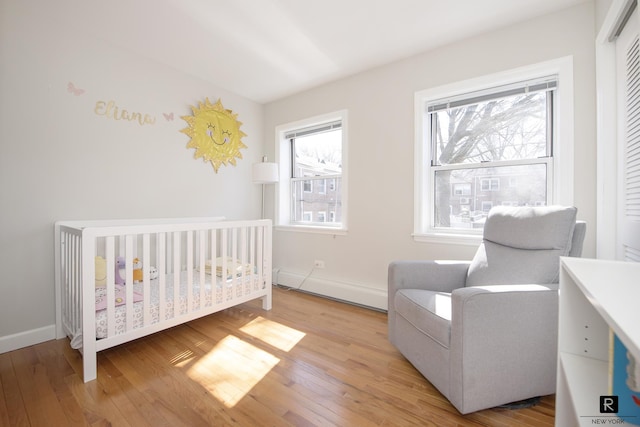 110-12 64th Ave Unit 2-Ab, New York City, NY 11375 - bedroom with wood finished floors, a nursery area, and a closet
