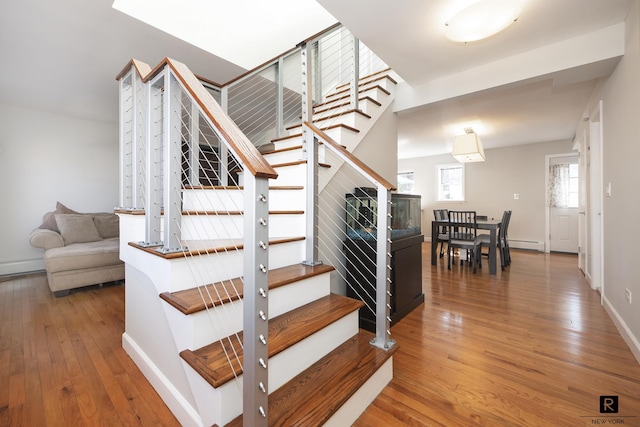 110-12 64th Ave Unit 2-Ab, New York City, NY 11375 - stairs with hardwood / wood-style floors and a baseboard radiator
