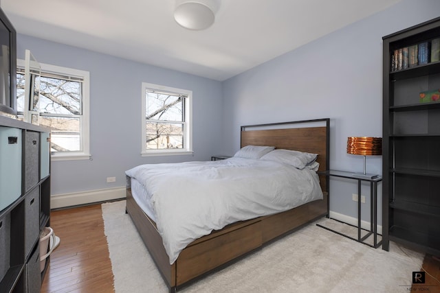 110-12 64th Ave Unit 2-Ab, New York City, NY 11375 - bedroom with multiple windows and wood finished floors
