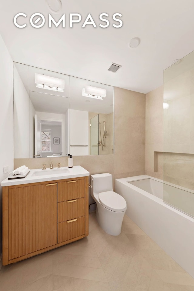 9 W 84th St, New York City, NY 10024 - bathroom featuring toilet, a bath, vanity, a shower, and tile patterned floors