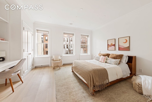 9 W 84th St, New York City, NY 10024 - bedroom with crown molding and light wood-style flooring