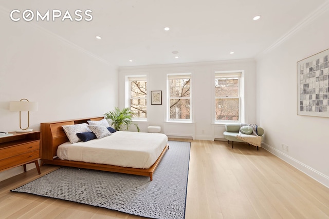 9 W 84th St, New York City, NY 10024 - bedroom with light wood-type flooring, crown molding, multiple windows, recessed lighting, and baseboards