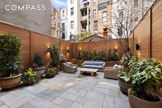 9 W 84th St, New York City, NY 10024 - fenced backyard with a patio and an outdoor hangout area