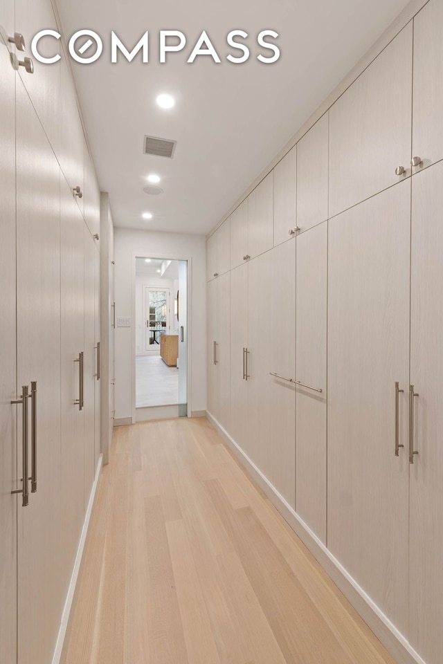 9 W 84th St, New York City, NY 10024 - corridor featuring light wood-type flooring, baseboards, and recessed lighting