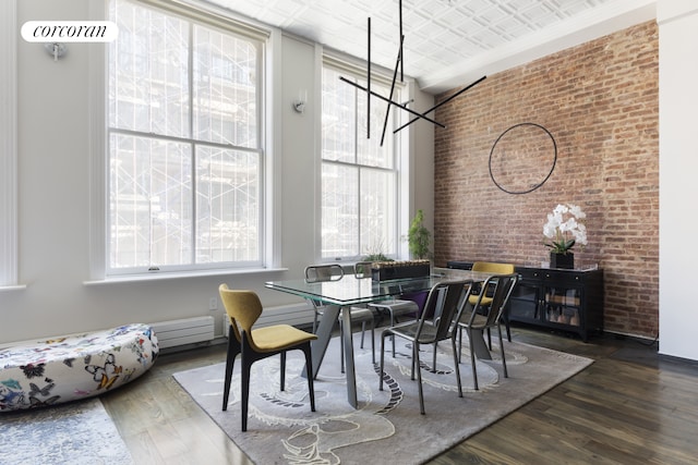 46 Lispenard St Unit 4E, New York City, NY 10013 - dining space with healthy amount of natural light, wood finished floors, and a chandelier
