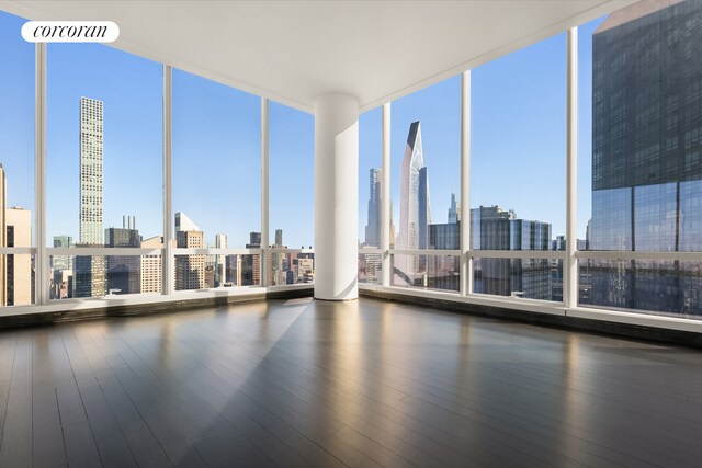 157 W 57th St Unit 56C, New York City, NY 10019 - spare room featuring plenty of natural light, visible vents, and a view of city