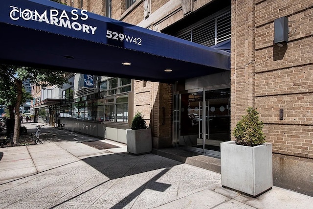 529 W 42nd St Unit 7N, New York City, NY 10036 - view of exterior entry with brick siding